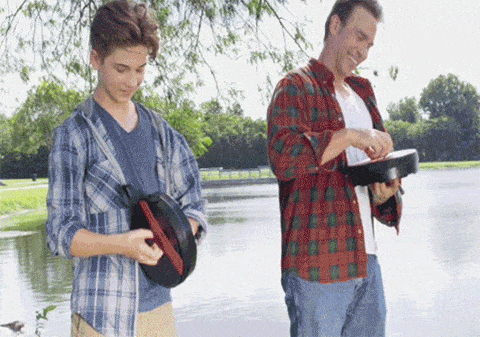Gif of father and son taking two Ninja Stools out while fishing and sitting on Ninja Stools