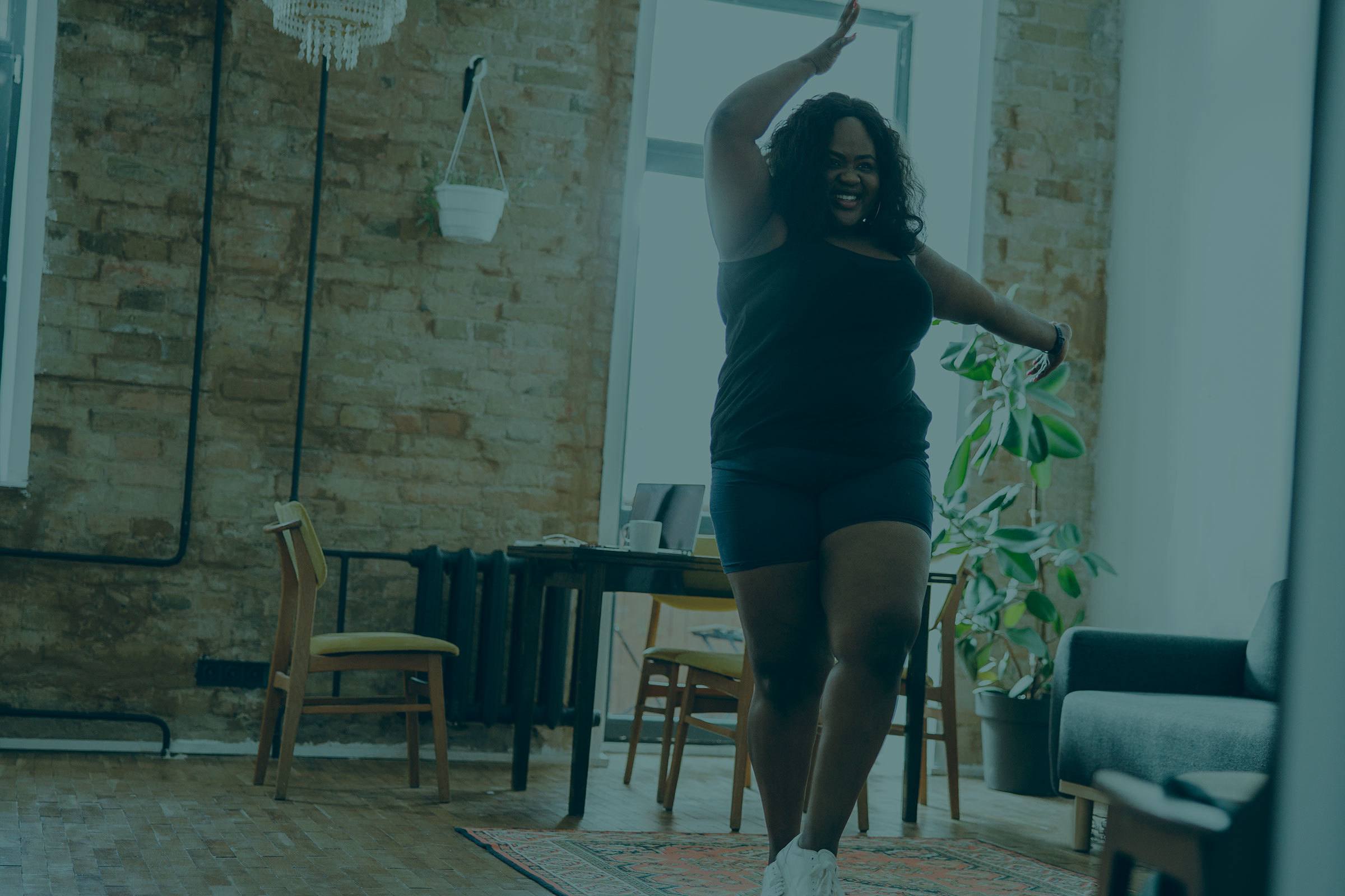background image of woman dancing at home
